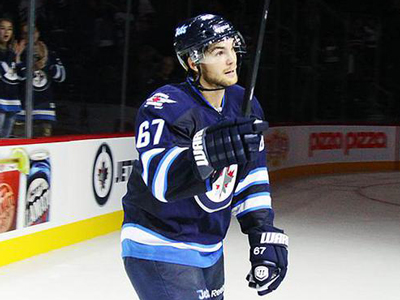 Michael Frolik of the Winnipeg Jets receives praise from the crowd while receiving "first star" of the season opener against the Edmonton Oilers at the MTS Centre in Winnipeg on October 4, 2013. (Getty Images)