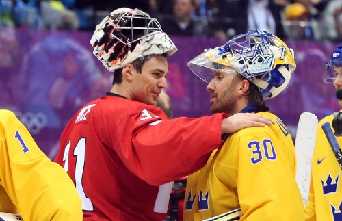 Carey Price and Henrik Lundqvist shake hands after Canada won gold at the 2014 Sochi Olympics. This meeting will determine who goes on to play for the Stanley Cup. (Photo by Jean Levac – Postmedia News)