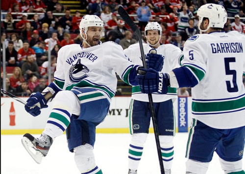    No time for Canucks, Coyotes to ponder recent losses     By Elliott Pap, Vancouver Sun February 25, 2013   0       Story     Photos ( 1 )   No time for Canucks, Coyotes to ponder recent losses   Vancouver Canucks left wing Chris Higgins, left, celebrates his first-period goal with defenceman Jason Garrison (5) during NHL game against the Detroit Red Wings on Sunday, Feb. 24, 2013, in Detroit. Photograph by: Duane Burleson , AP 