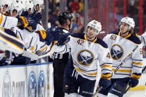 Nathan Gerbe #42 of the Buffalo Sabres celebrates his goal with teammates against the Florida Panthers Photo Credit: Eliot J. Schechter/NHLI via Getty Images)