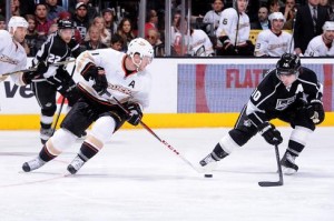 LOS ANGELES, CA - FEBRUARY 25: Saku Koivu #11 of the Anaheim Ducks skates with the puck against Mike Richards #10 of the Los Angeles Kings at Staples Center on February 25, 2013 in Los Angeles, California. (Photo by Andrew D. Bernstein/NHLI via Getty Images)