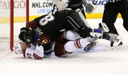Raffi Torres #37 of the Phoenix Coyotes and Drew Doughty #8 of the Los Angeles Kings wrestle on the ice