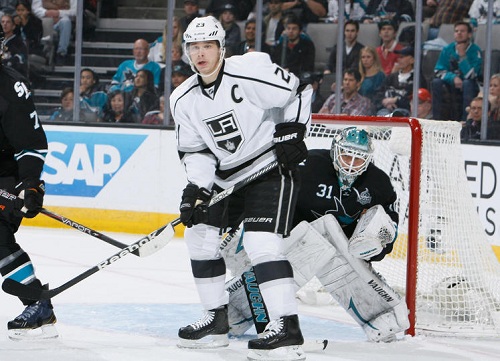 San Jose Sharks looks for the puck against Dustin Brown
