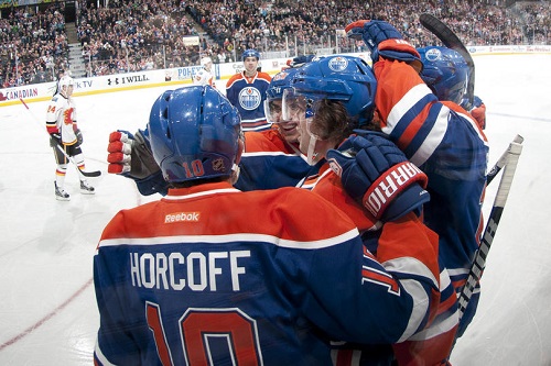 Shawn Horcoff, Ryan Jones and Nail Yakupov of the Edmonton Oilers celebrate after scoring a goal against the Calgary Flames on April 1 at Rexall Place. (Photo by Andy Devlin/NHLI via Getty Images)