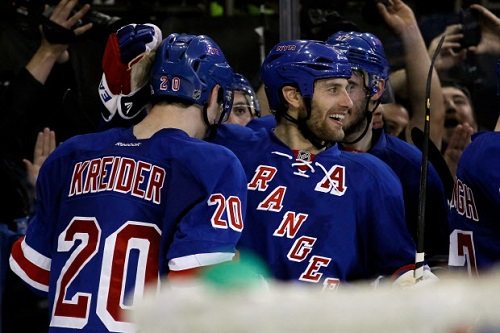 Chris Kreider #20 and Ryan Callahan #24 of the New York Rangers celebrate after Kreider scored the game-winning goal in overtime to give the Rangers a 4-3 win against the Boston Bruins in Game Four of the Eastern Conference Semifinals during the 2013 NHL Stanley Cup Playoffs at Madison Square Garden on May 23, 2013 in New York City.  (Photo by Bruce Bennett/Getty Images)