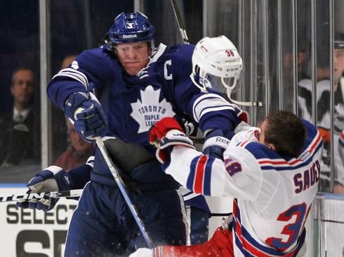 This hit by Maple Leafs D Dion Phaneuf is the last action Rangers D Michael Sauer may ever see at the NHL level. (Bruce Bennett - Getty Images)  
