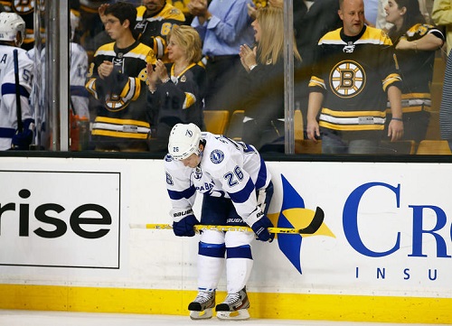 Lightning captain Martin St. Louis looked dismayed following their disappointing season-opening performance against the Boston Bruins on Thursday night. The Bolts allowed two shorthanded goals in the 3-1 loss. Credit: Jared Wickerham/Getty Images