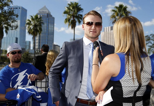 Lightning star Steven Stamkos is interviewed as he arrives for the team's home opener against the Florida Panthers at the Tampa Bay Times Forum on Thursday night. He went on to collect his sixth career hat trick in the game. Mike Carlson/Getty Images