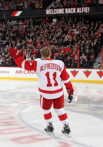 Daniel Alfredsson of the Detroit Red Wings waves to fans after a video tribute prior to his first game back to play against the Ottawa Senators at Canadian Tire Centre on December 1, 2013 in Ottawa, Ontario, Canada. (Photo by Andre Ringuette/NHLI via Getty Images)