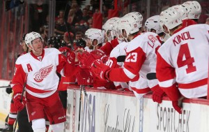 Daniel Alfredsson #11 of the Detroit Red Wings celebrates his third period, empty net goal against the Ottawa Senators with teammates at Canadian Tire Centre on December 1, 2013 in Ottawa, Ontario, Canada. (Photo by Andre Ringuette/NHLI via Getty Images)
