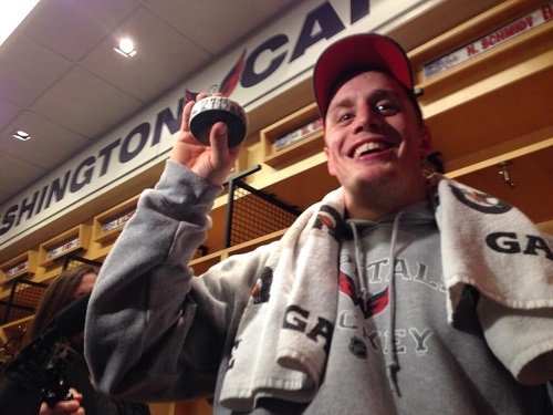 Nate Schmidt holding his first NHL goal puck