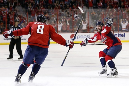 Alexander Ovechkin celebrates a goal with teammate Mike Green Sunday evening when the Caps hosted the Flyers and won in a shootout 5-4. (Photo by Geoff Burke/USA Today Sports)