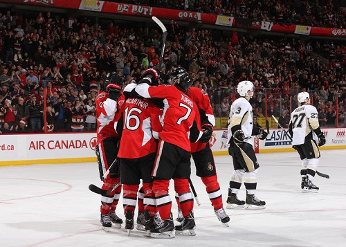 Kyle Turris #7 of the Ottawa Senators celebrates his third period goal against the Pittsburgh Penguins with team mate Clarke MacArthur #16 during an NHL game at Canadian Tire Centre on December 23, 2013 in Ottawa, Ontario, Canada. (Photo by Jana Chytilova/NHLI via Getty Images)