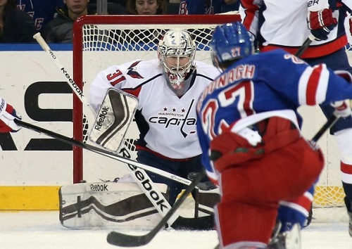 (New York City) December 8th Captials Philipp Grubauer #31 attempts to save a shot from Rangers Ryan McDonagh #27 Credit: Bruce Bennett/Getty Images