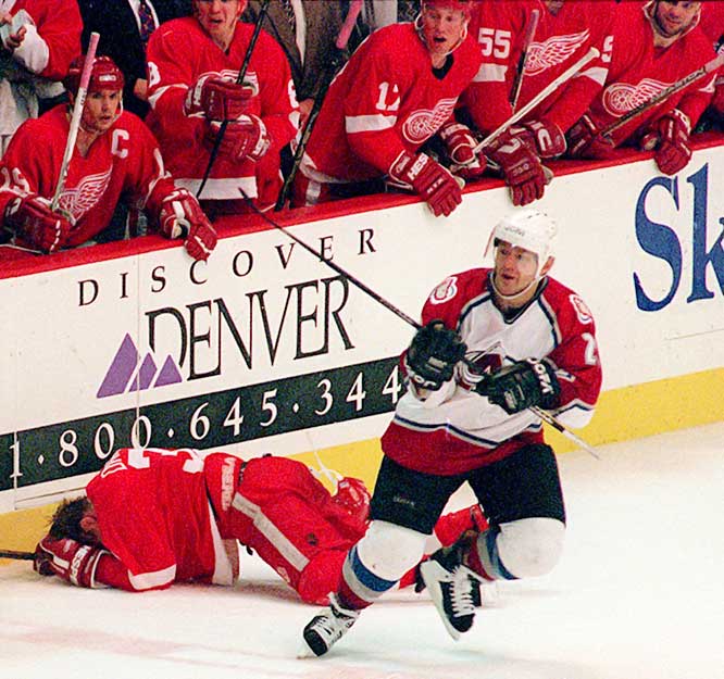 Lemieux was always known as a pest, especially after this hit on Kris Draper into the boards from behind in the 1996 Playoffs. (Photo credit: Image Slides)