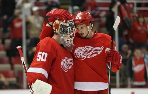Jonathan Ericsson congratulates goaltender Jonas Gustavsson after Detroit defeated Montreal 4-1. Both players have recently returned from injury.  (Photo by Leon Halip/Getty Images)