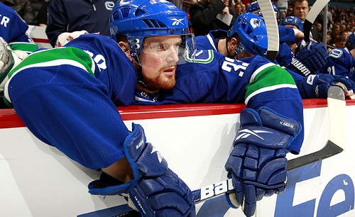 Henrik Sedin looks on after his team suffers yet another agonizing loss. (Phoyo by Jeff Vinnick/Getty Images)