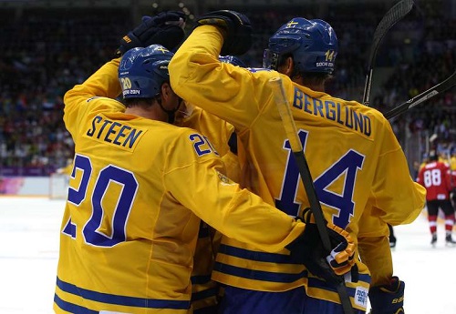 Patrik Berglund and Alexander Steen hug it out over Sweden's Olympic silver medal. Credit: Getty Images