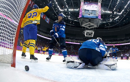 Daniel Sedin celebrates Erik Karlsson’s eventual game-winning power play goal. (Photo by Getty Images)