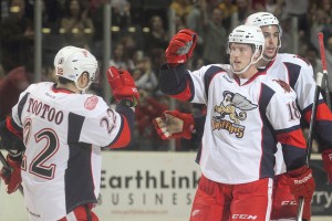 Jordin Tootoo and Cory Emmerton (center) celebrate after the latter scores the game-winner from the former. (Photo by Mark Newman)