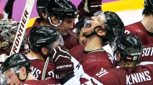Latvia forward Lauris Darzins, celebrates with his teammates after Latvia beat Switzerland 3-1 to advance to the quarterfinals Tuesday, Feb. 18, 2014, in Sochi, Russia. (AP / Julio Cortez)