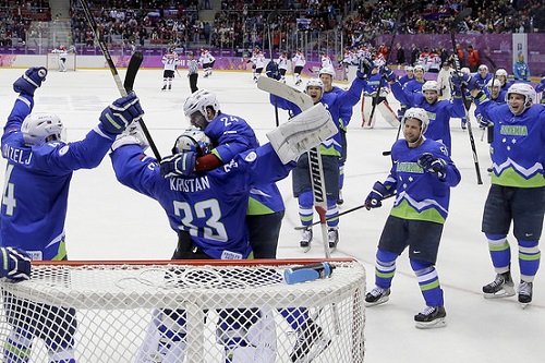 The Slovenian's celebrate after getting the win.  Credit: The Associated Press