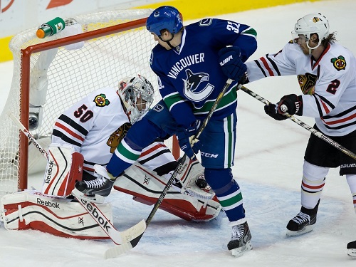 Dale Weise trying to score a rare goal for the Canucks against the hot Chicago Blackhawks earlier in the season.  Credit: Darryl Dyck/The Canadian Press