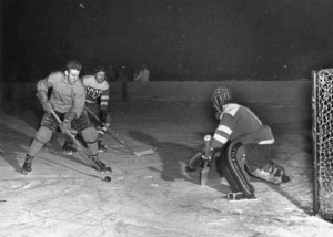 Sven Tumba, Sweden's all-time leading scorer in olympic history, takes a shot on a Soviet Union goalie. Had 25 goals in 29 career Olympic games. Photographer is unknown.