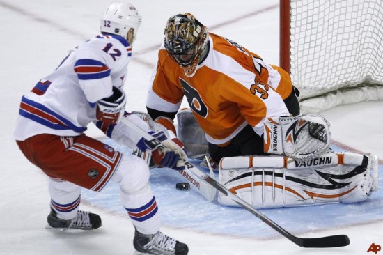Olli Jokinen is stoned by Brian Boucher to send the Flyers to the playoffs, and the Rangers home for the season. (Photo by Matt Slocum – AP Photo)