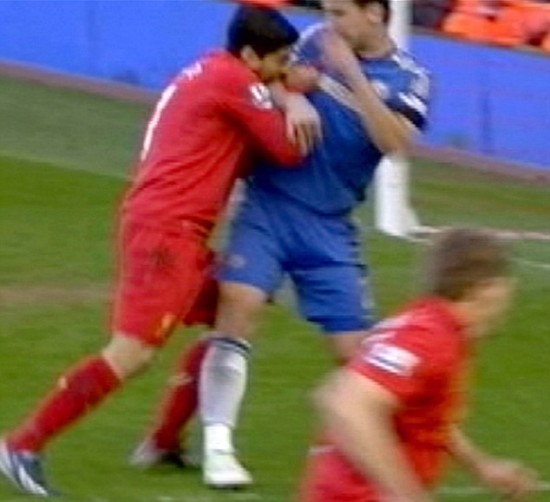 Replay of Liverpool striker Luis Suarez biting into the arm of Chelsea defender Branislav Ivanovic during their premiership match earlier on Tuesday. (AP photos)