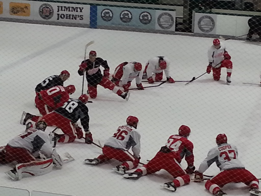 Jared Coreau (#31, left side) stretches with the rest of Team Yzerman after the first day of on-ice training at Centre Ice Arena in Traverse City. (Photo taken by author)