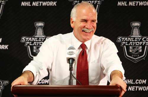 Joel Quenneville addresses the media after a game. (Photo by Bill Smith/Getty Images)