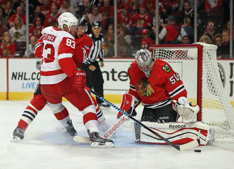 Johan Franzen drives to the net during a preseason contest against the Chicago Blackhawks on September 23rd. (Photo by Jonathan Daniel/Getty Images)