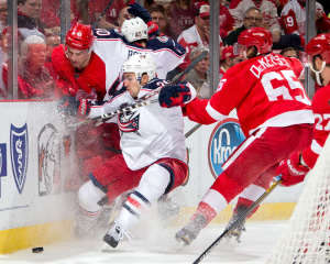 Defenseman Danny DeKeyser battles for the puck in his first game after returning from an upper-body injury. (Photo by Dave Reginek/NHLI via Getty Images)