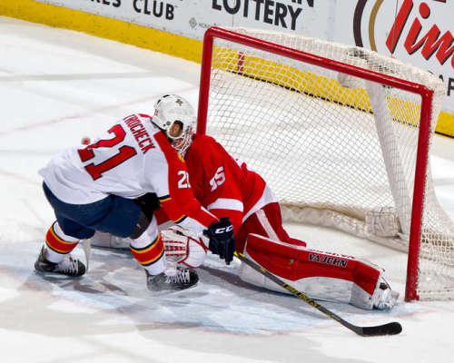 Vincent Trocheck scores a shootout goal on Jimmy Howard in a Red Wings loss on December 12, 2014. Howard nearly stopped the shot, but Trocheck found a small opening between Howard's skate and the left post. (Photo by Dave Reginek/NHLI via Getty Images)