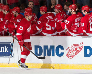 Detroit's Tomas Tatar celebrates with his teammates after scoring a goal on January 17th, 2015. (Photo by Dave Reginek/NHLI via Getty Images)