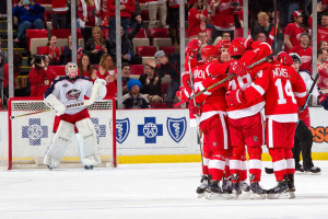Detroit's Justin Abdelkader is congratulated by his teammates after scoring the lone goal for his team in a game against the Columbus Blue Jackets on March 12, 2015. (Photo by Dave Reginek/NHLI via Getty Images)