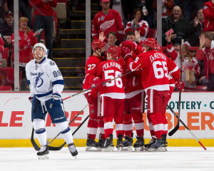 Detroit's Joakim Andersson celebrates what would be the game-winning goal with his teammates during a matchup against the Tampa Bay Lightning on March 28, 2015. (Photo by Dave Reginek/NHLI via Getty Images)
