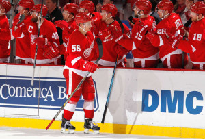 Detroit's Teemu Pulkkinen is congratulated by his teammates after scoring his team's third goal in a 5-2 victory on March 9, 2015. (Photo by Gregory Shamus/Getty Images)