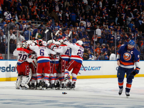 The Washington Capitals celebrate their OT goal in Game Four to even their series with the Islanders at 2-2. (Bruce Bennett – Getty Images)