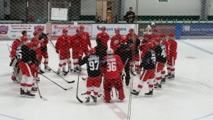 Members of Team Lindsay prepare for a drill during Saturday morning's practice on Day 2 of the Red Wings Prospect Development Camp in Traverse City, MI. July 4, 2015 (Photo by Author)