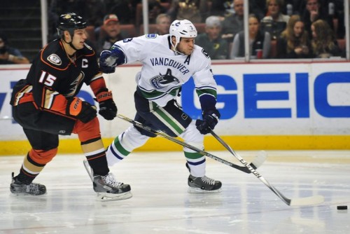 Kevin Bieksa will be sharing a locker room with Ryan Getzlaf instead of defending him. (Gary A. Vasquez – USA Today Sports)