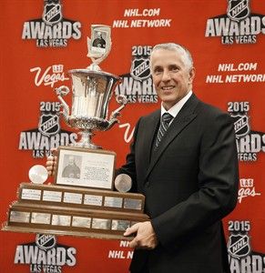 Flames' coach Bob Hartley posing with the Jack Adams Award trophy at the 2015 NHL Awards Show. (AP Photo/ John Locher)