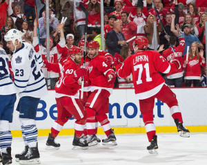 Red Wings forward Justin Abdelkader celebrates his second goal of the first period with teammates Zetterberg (40), Kindl (4), and Larkin. Larkin recorded his first NHL point on the play. (Photo by Dave Reginek/NHLI via Getty Images)