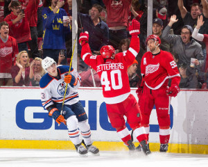 Niklas Kronwall and Henrik Zetterberg celebrate the game-winning goal against the Edmonton Oilers in a game on November 28, 2015. (Photo by Dave Reginek/NHLI via Getty Images)