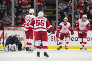 Detroit's Jonathan Ericsson celebrates his second period goal with teammates Niklas Kronwall, Luke Glendening and Brad Richards (from left to right) during a game against the Winnipeg Jets on March 10, 2015.  (Photo by Dave Reginek/NHLI via Getty Images)
