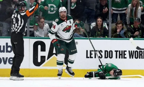 Matt Dumba of the Minnesota Wild warms up wearing a Pride Night