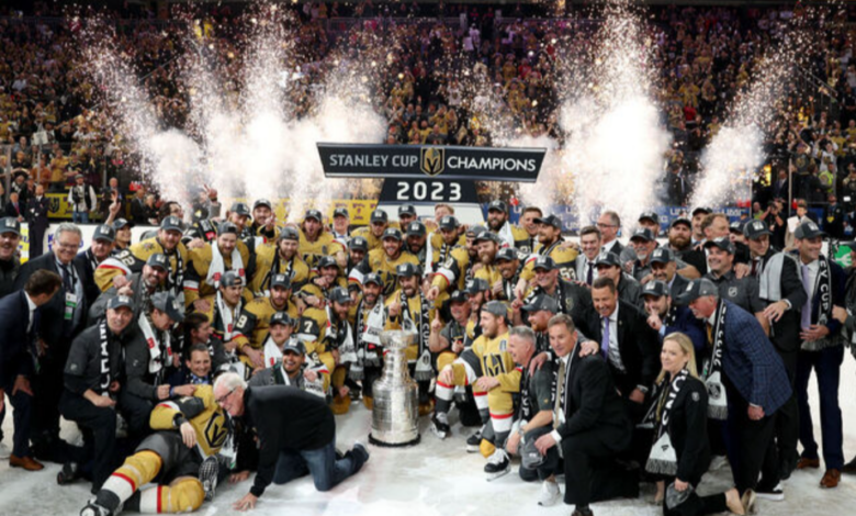 Golden Knights players celebrate with the Stanley Cup trophy